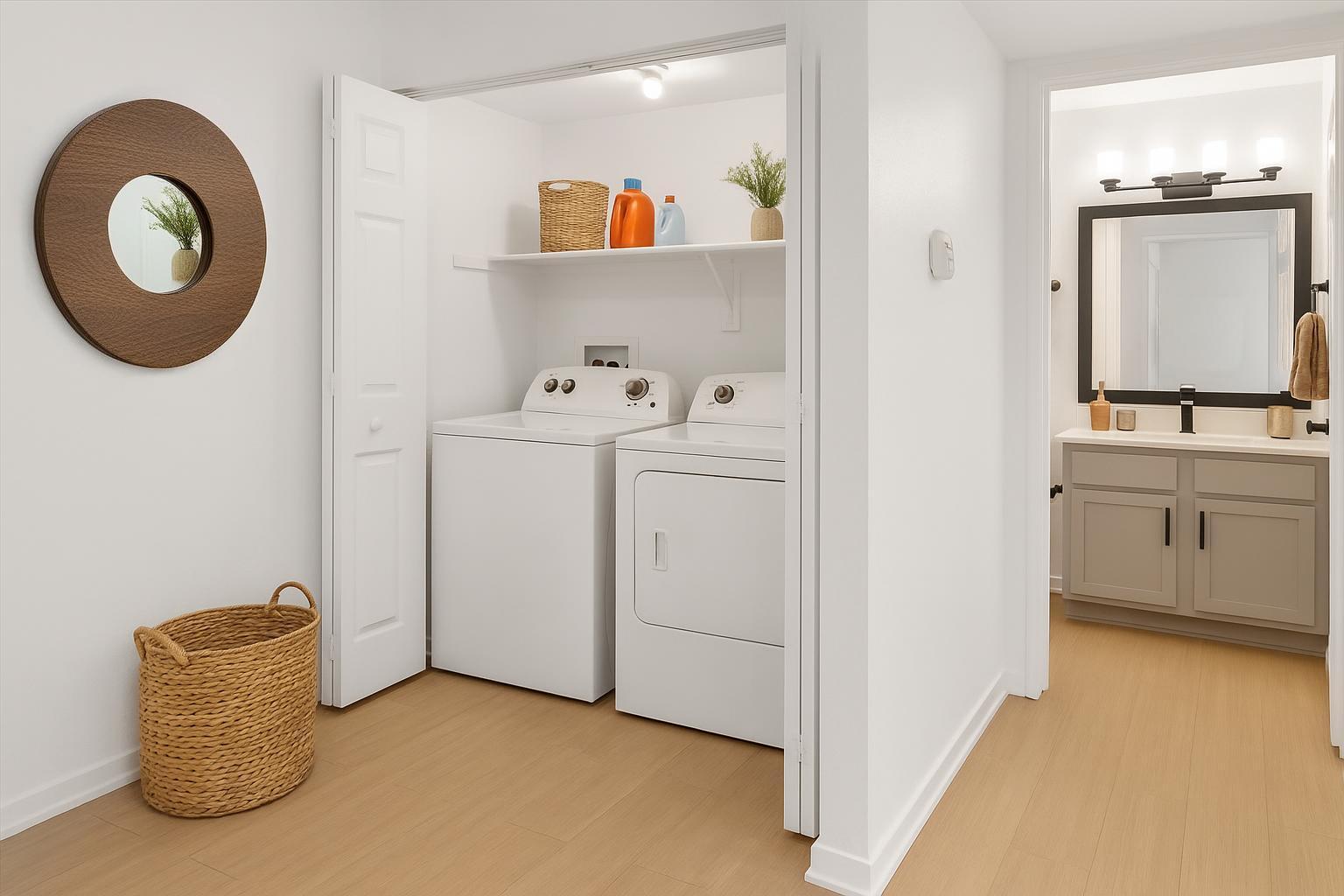 a laundry room with a washer and dryer at The Residences at Bear Creek